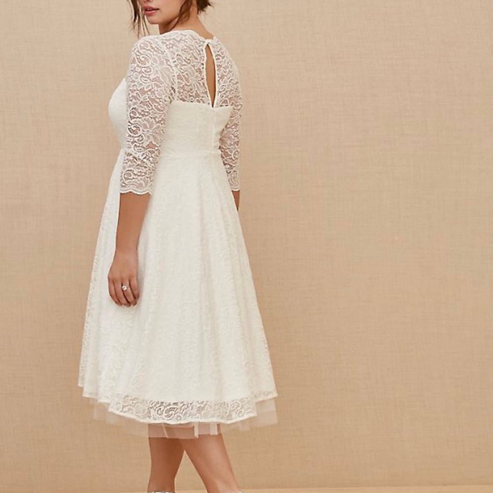 Torrid size 30. Wedding dress ivory with lace detailing. Retails for $198.